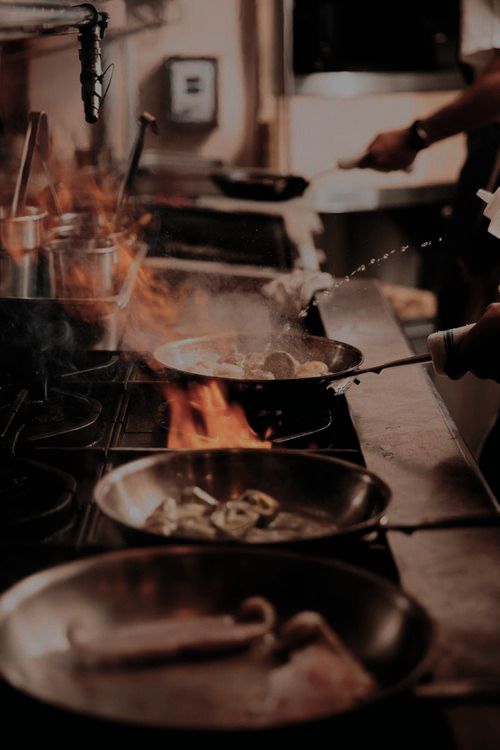 A chef cooking in a restaurant kitchen
